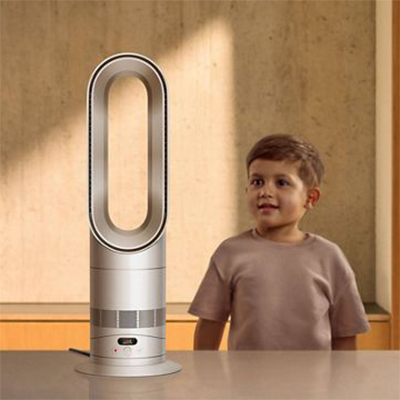 Young boy looking closely at a Dyson bladeless fan. Heating & Cooling Category Link.