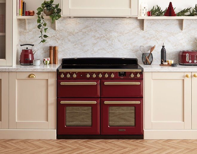 Official Rangemaster red range cooker in a cream kitchen